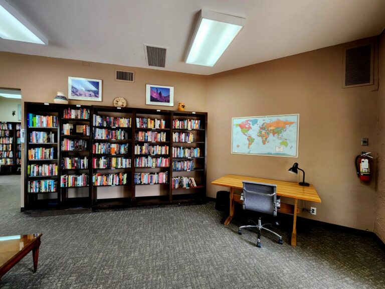 More books and a work desk. The library has free WIFI for residents.